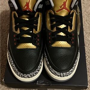 Nikes Black and Gold Sneakers